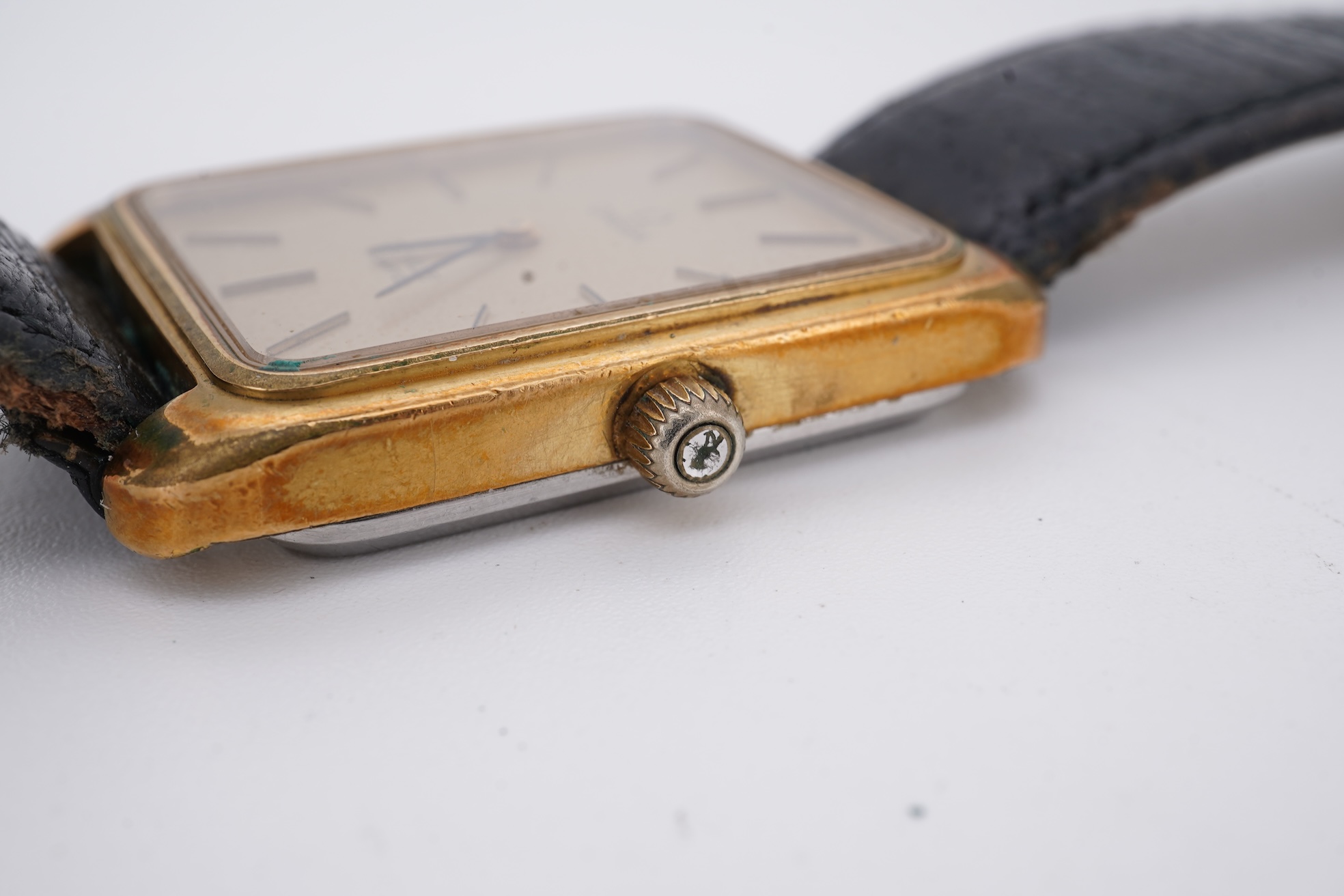 A gentleman's late 1970's steel and gold plated Omega De Ville quartz wrist watch, with rectangular dial and baton numerals, movement c.1330, case diameter 30mm, no buckle, box or papers.